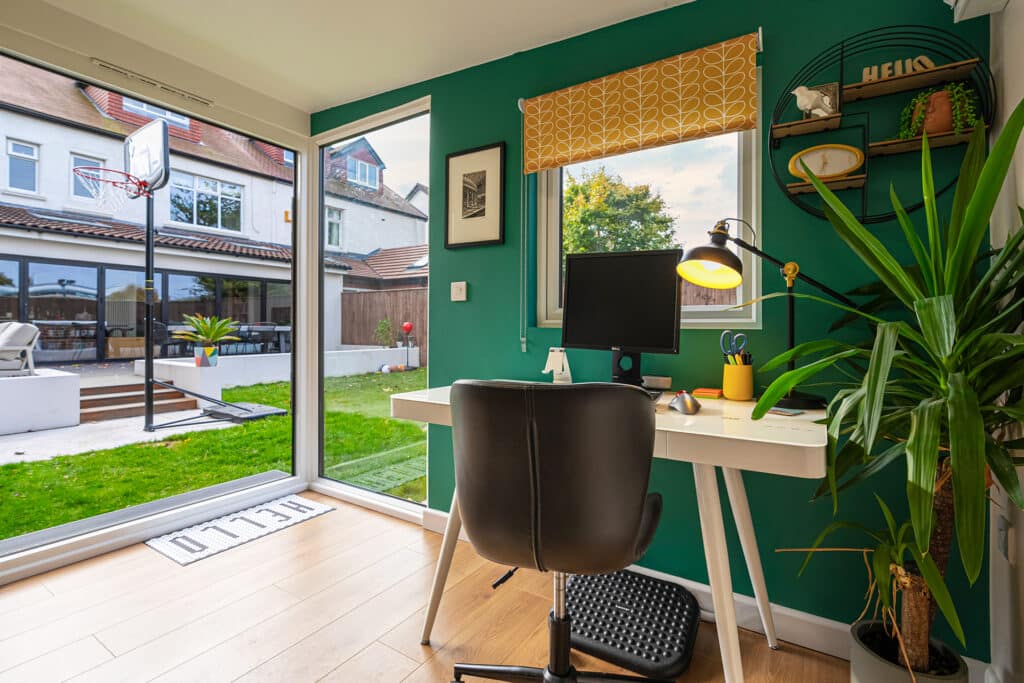 fully insulated garden office interior with desk and workspace