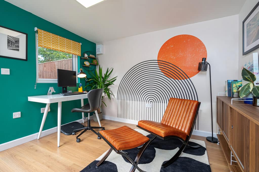 Interior of garden room showing vibrant feature wall